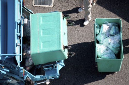 Construction site with builders removing waste debris